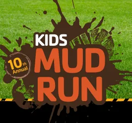 A boot print in a puddle of mud. 10th annual kids mud run. 