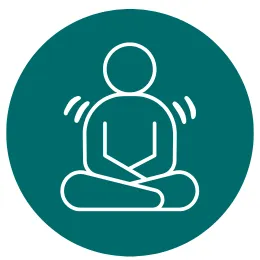 a person sitting in a yoga pose. 