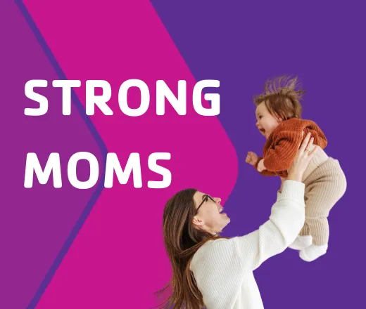 A mother lifting her infant into the air.