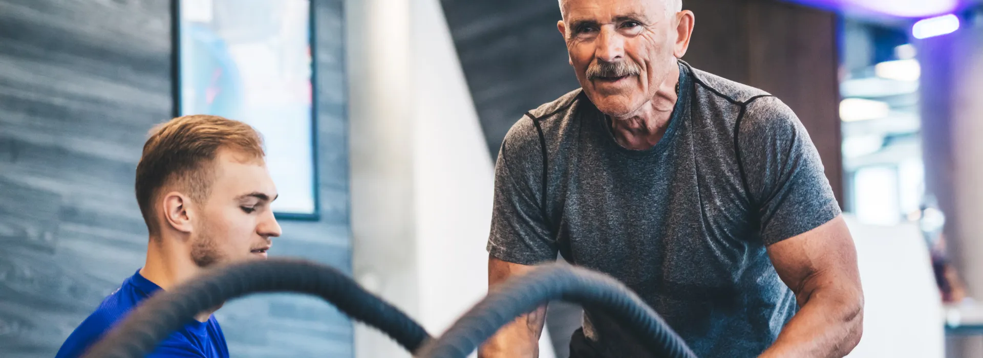 Personal trainer working with older adult